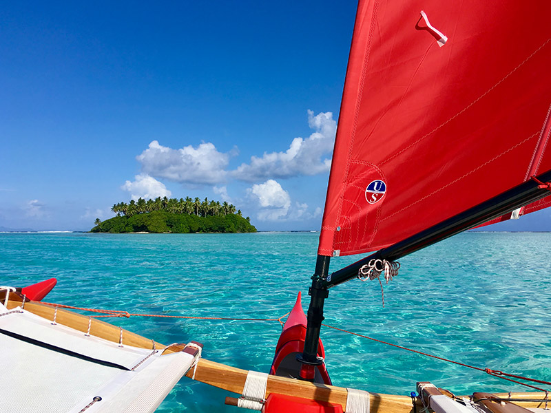 Pahi sailing canoes fushing in the lagoon of Rajatea